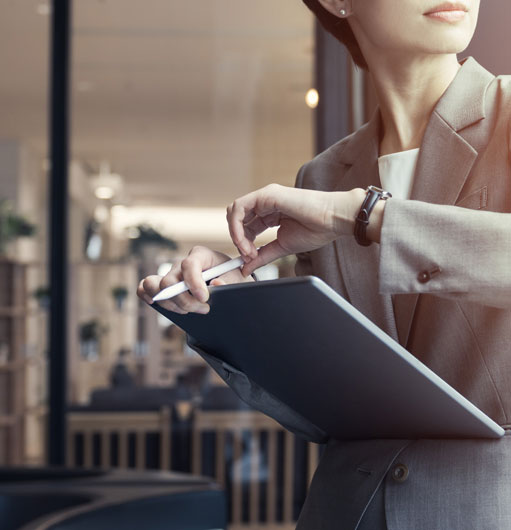 Woman checking kronos app on tablet Woman checking kronos app on tablet